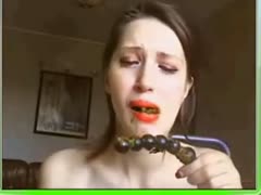 A pretty girl licks her poop-filled sex toy.